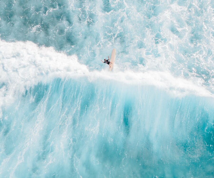 a man surfing on sea waves